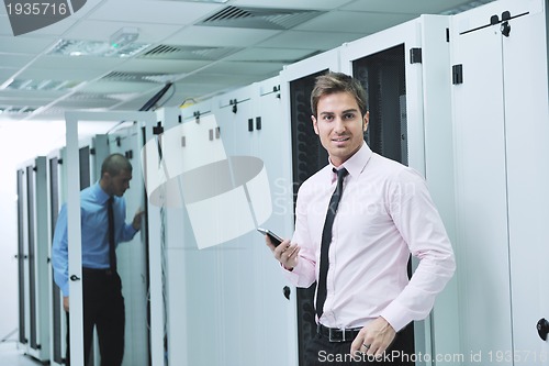 Image of it enineers in network server room