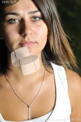 Image of brunette Cute young woman  posing outdoors