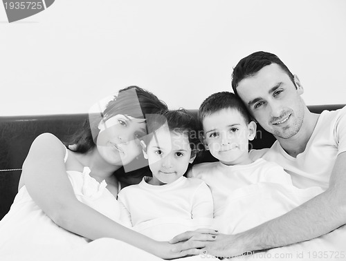 Image of happy young Family in their bedroom