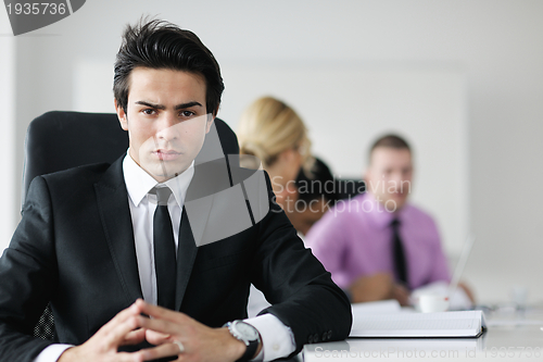 Image of young business man at meeting