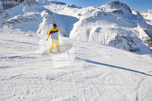 Image of skiing on fresh snow at winter season at beautiful sunny day