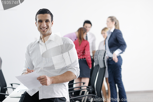 Image of young business man at meeting