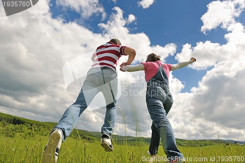 Image of romantic young couple in love together outdoor