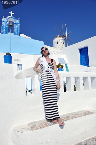 Image of Greek woman on the streets of Oia, Santorini, Greece