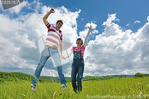 Image of romantic young couple in love together outdoor