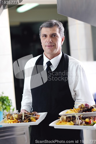 Image of chef preparing meal