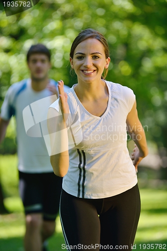 Image of Young couple jogging