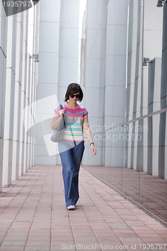 Image of beautiful young woman in the city