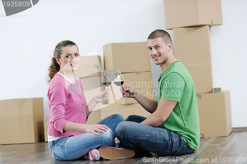 Image of Young couple moving in new house