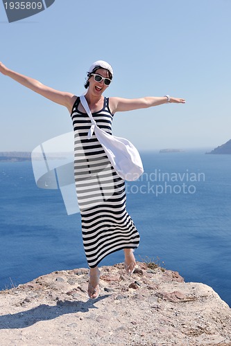 Image of Greek woman on the streets of Oia, Santorini, Greece