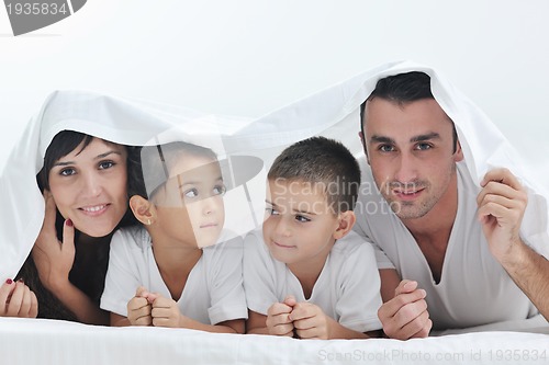 Image of happy young Family in their bedroom