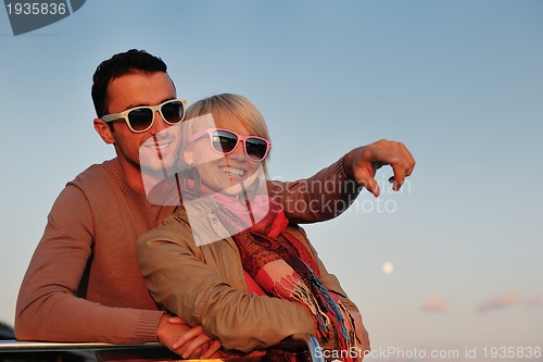 Image of couple in love  have romantic time on boat