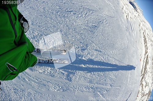 Image of skiing on fresh snow at winter season at beautiful sunny day