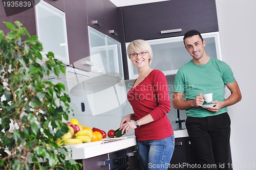 Image of young couple have fun in modern kitchen