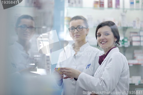 Image of team of pharmacist chemist woman  in pharmacy drugstore