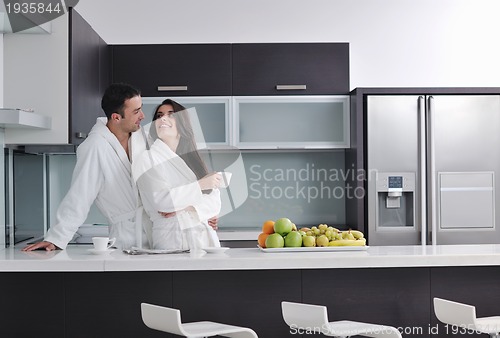 Image of young couple have fun in modern kitchen
