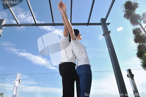 Image of couple relaxing on balcony
