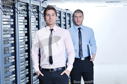 Image of it enineers in network server room