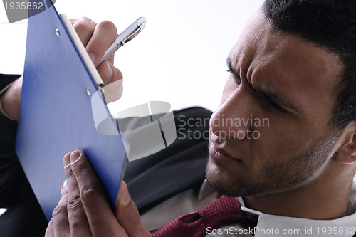 Image of business man trying to read