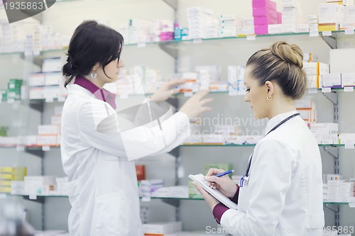 Image of team of pharmacist chemist woman  in pharmacy drugstore