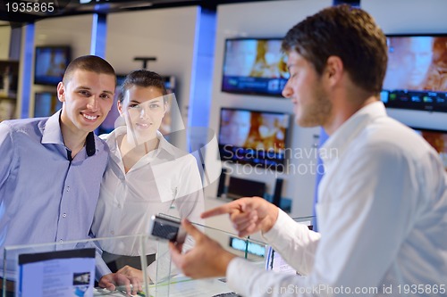 Image of people buy  in consumer electronics store