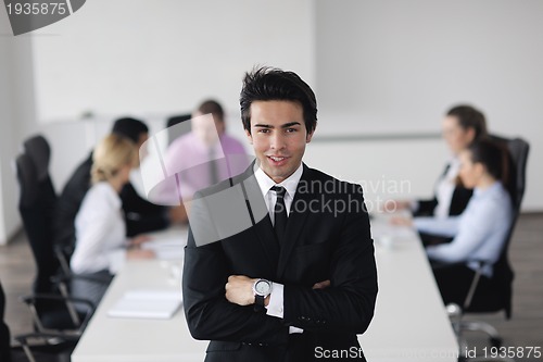 Image of young business man at meeting