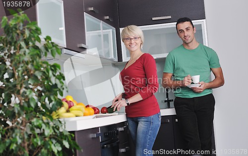 Image of young couple have fun in modern kitchen
