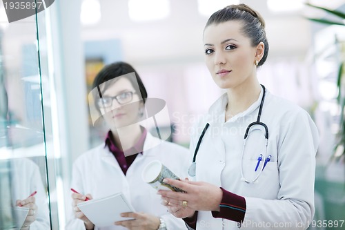 Image of team of pharmacist chemist woman  in pharmacy drugstore