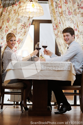 Image of young couple having dinner at a restaurant