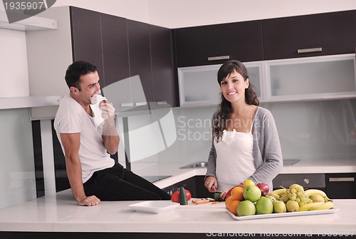 Image of young couple have fun in modern kitchen