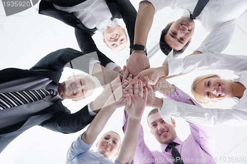 Image of business people group joining hands