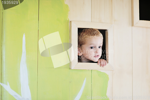 Image of happy child in a window