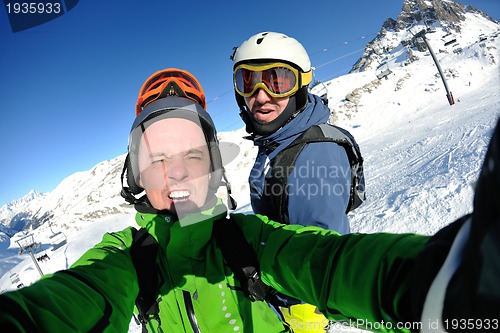 Image of winter portrait of friends at skiing