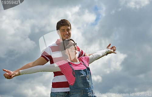 Image of romantic young couple in love together outdoor