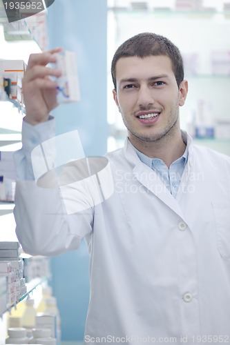 Image of pharmacist chemist man in pharmacy drugstore