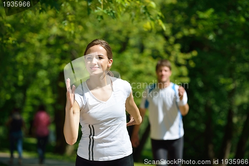 Image of Young couple jogging