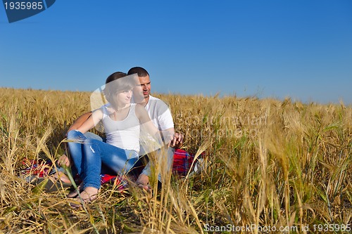 Image of happy couple in wheat field