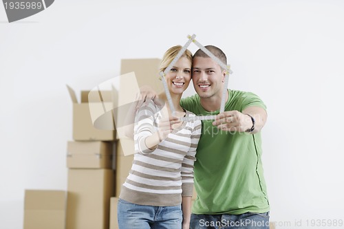 Image of Young couple moving in new home