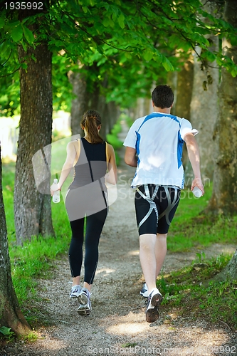 Image of Young couple jogging