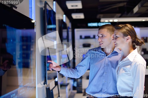 Image of people buy  in consumer electronics store