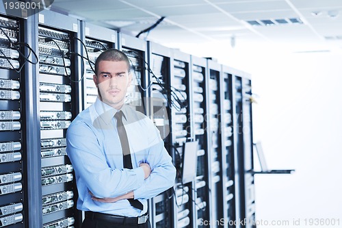 Image of young it engeneer in datacenter server room