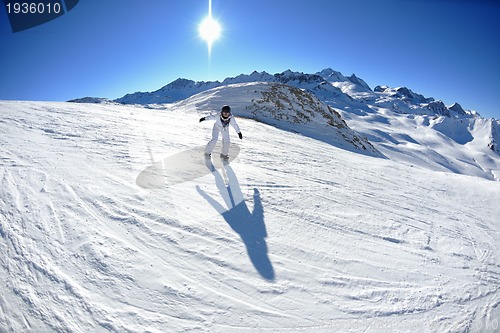 Image of skiing on fresh snow at winter season at beautiful sunny day