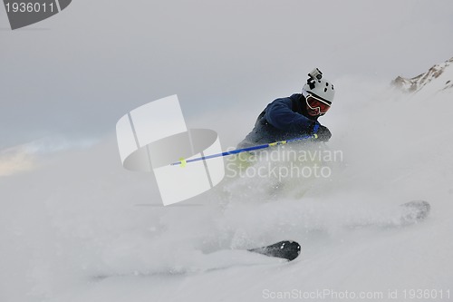 Image of skiing on fresh snow at winter season at beautiful sunny day