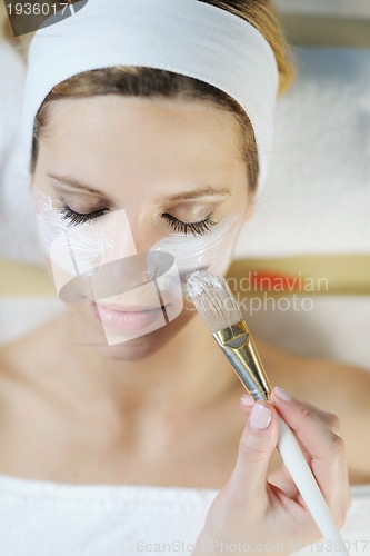 Image of Beautiful young woman in spa