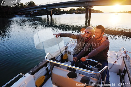 Image of couple in love  have romantic time on boat