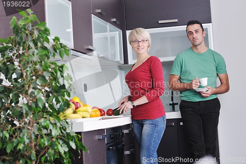 Image of young couple have fun in modern kitchen