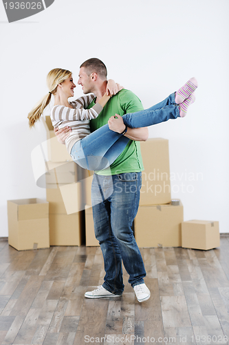 Image of Young couple moving in new house