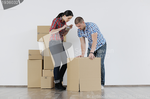 Image of Young couple moving in new house