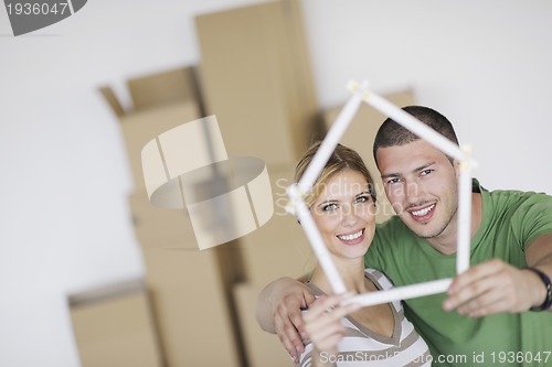 Image of Young couple moving in new home