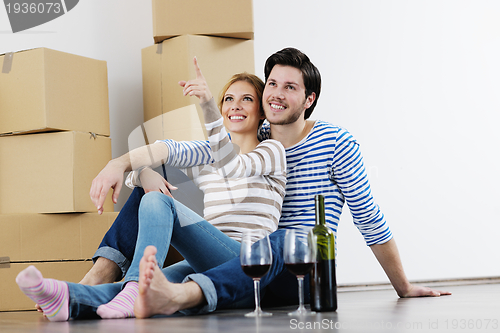 Image of Young couple moving in new house